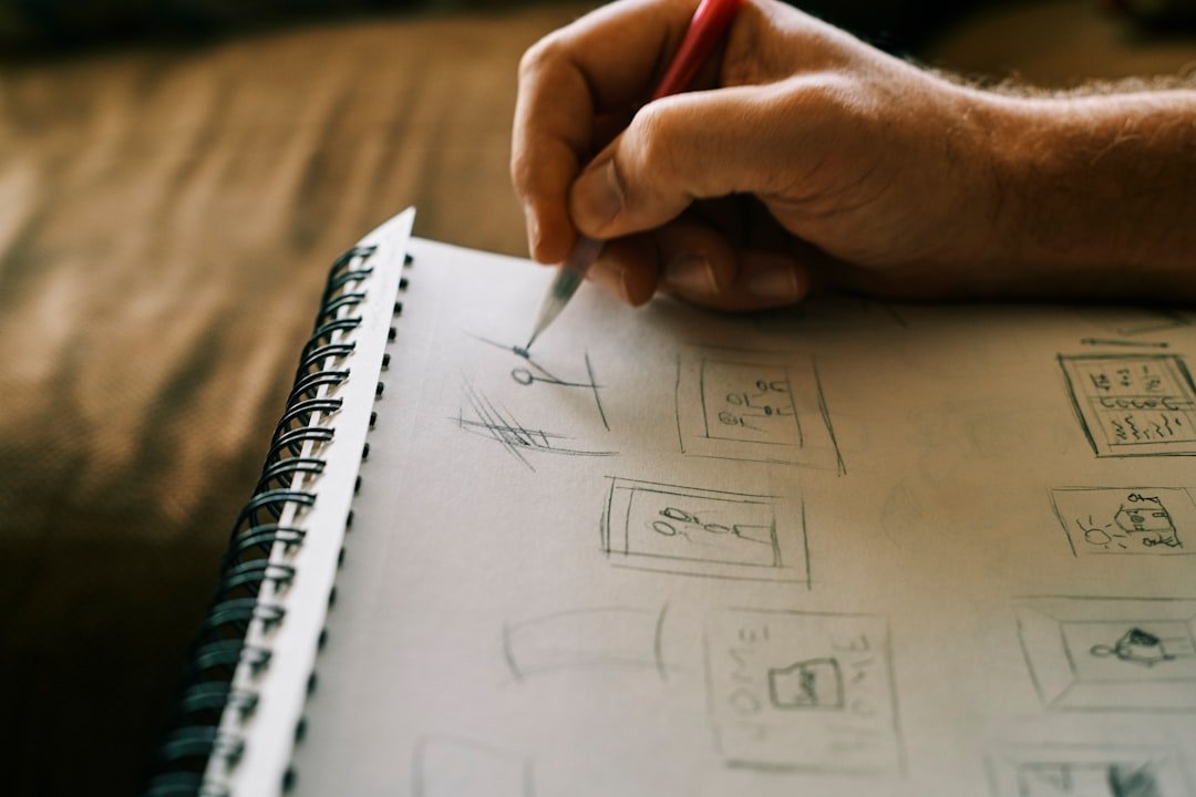 Person writing in a notebook while planning a home project